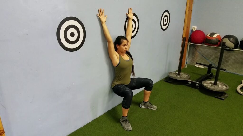 wall exercises - wall sit witch arm circles